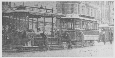 Elizabeth Street cable tram pushed by workmen