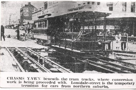 "Chasms Yawn beneath the tram tracks"