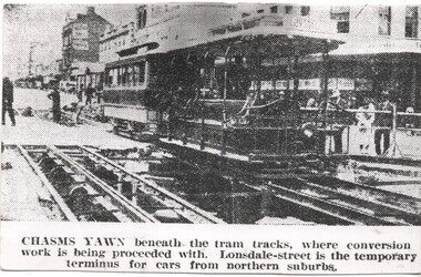 "Chasms Yawn beneath the tram tracks"