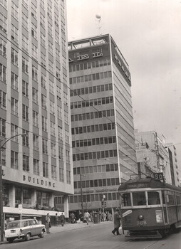 Tram 988 with Queen and Bourke St buildings