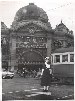 Flinders and Swanston St and policewomen on traffic control duties.