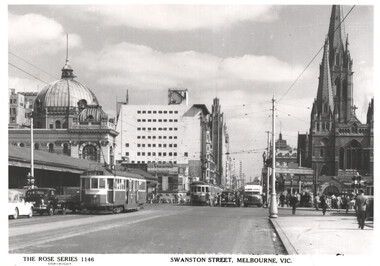 Photograph of Swanston Street, Melbourne, showing trams on the street, a domed building, Flinders St station on the left and a gothic-style church spire of St Paul's cathedral on the right.