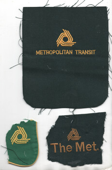 Three fabric patches with embroidered logos and text related to "Metropolitan Transit" and "The Met."