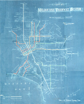 Vintage blueprint map of the City of Melbourne Tramway System, showing routes in red, orange, yellow, and green, with key suburbs and geographical features like Hobson's Bay.