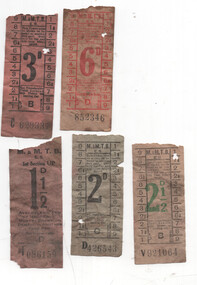A collection of five worn, vintage paper tram tickets, each with printed fare denominations, ticket numbers, and transit authority markings.