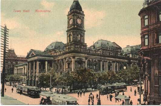 Postcard depicting Melbourne Town Hall with its prominent clock tower and neoclassical architecture, on a busy street with cable trams and pedestrians.