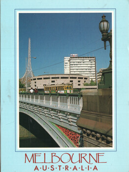 A street scene in Melbourne, Australia, featuring a historic tram, a Mobil building, a tall white building, and a distinctive bridge railing against a bright blue sky.