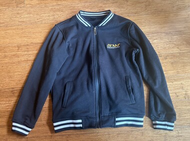 Dark blue zip-up jacket with white and light blue striped cuffs and collar. The jacket features a small embroidered yellow and white logo on the left chest area.
