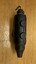 A black metal object with two rounded loops on the left side and a tapering point on the bottom.