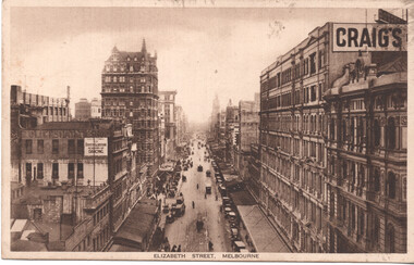 Vintage sepia-toned postcard view looking down a bustling street lined with multi-story buildings, featuring cable trams, horse-drawn carriages, early automobiles, and pedestrians, with a sign for "CRAIG'S" prominently displayed on a building facade.