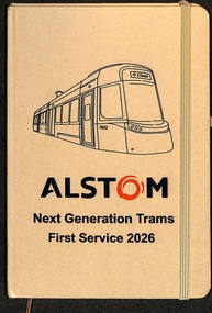A notebook with an illustration of a modern tram on the cover, below which is the Alstom logo and the text "Next Generation Trams First Service 2026".