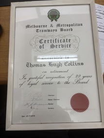 Framed "Certificate of Service" from the Melbourne & Metropolitan Tramways Board presented to Thomas Hugh Collins for 29 years of loyal service upon his retirement, dated July 15, 1975, with signatures and a red wax seal.