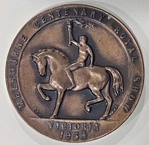 A bronze-coloured medal for the 1934 Melbourne Royal Centenary Show, showing a horse design.