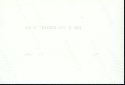 Reverse side of the photograph which is blank.