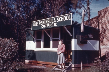 Photo shows Miss Nan Morton outside the Peninsula School's first office.