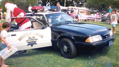 Photograph, Faye Lamb, Christmas picnics at Heidelberg Golf Club - Santa in car, 1990