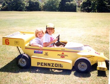 Photograph, Faye Lamb, Christmas picnics at Heidelberg Golf Club - Children in toy race car, 1990