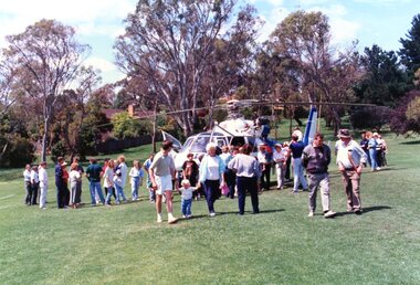 Photograph, Faye Lamb, Christmas picnics at Heidelberg Golf Club - Helicopter arrives at Christmas picnic, 1990