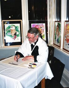 Photograph, Heidelberg Golf Club, Heidelberg Golf Club: 75th anniversary dinner - Caricature artist at work, 16/08/2003