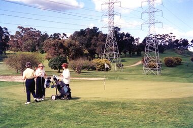 Photograph, Heidelberg Golf Club, Players and caddies on the 18th green 2001, 2001