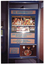 COL photo of one panel from a large, freestanding, multi-panel display board. Under the heading, "EAT APPROPRIATELY" are is a group of captioned photos under the sub-heading "A food guide for good health". Immediately below that are the headings, "GOOD NUTRITION IS NECESSARY FOR GOOD HEALTH." and "AVOID OVEREATING EXTRA WEIGHT ADDS STRESS ['Adds stress' is underlined] TO THE JOINTS." At the bottom of the panel is the heading "CO-ORDINATE MEALS WITH MEDICATION" beside a photo of a plate of food with fruit, drinks, cutlery and medications on a table.
