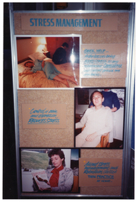 COL photo of a large freestanding display board. Under the heading "STRESS MANAGEMENT" are three photos, each with some accompanying text. The first photo depicts a woman lying on her side in bed, while a man sits on the edge of the other side of the bed. They have their backs to one another. The accompanying text is, "SEEK HELP... Arthritis can bring ADDED STRESS to any relationship. Counselling and support groups are available." The second photo depicts a man sitting in a chair, with a woman behind him massaging his shoulders. The accompanying text is, "Control of pain and depression REDUCES STRESS". The third photo depicts a woman sitting in a chair by a window. She is reading a book titled, "Stress and Relaxation". The accompanying text is, "Attend Stress management and Relaxation classes THEN PRACTICE AT HOME."