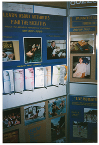 COL photo of a large freestanding display board. Board panels contain information, brochure samples, and Photographs under various headings. These include "LEARN ABOUT ARTHRITIS FIND THE FACILITIES", with the sub-heading "PHONE THE ARTHRITIS FOUNDATION OF VICTORIA (03) 862-2555"; "PAIN NEEDS ACT... [partially obscured] FOR RELIEF", followed by the text "HAVE YOU TRIED-"; and "LIVE AND HAVE FU... [partially obscured] CONTACT THE RECREATION DEVELOP... [partially obscured] CO-ORDINATOR AT THE ARTHRITIS FOUND... [partially obscured]", followed by the text, "GO ON A TRIP". Under the heading "LEAFLETS ABOUT ARTHRITIS", sample brochures attached to the display board include titles such as "About Arthritis in Children", "About Osteoarthritis", "About Arthritis", "About Rheumatoid Arthritis", and "About Diet".