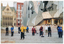 COL photo of a group of people standing in a paved town square. They are holding their arms straight, with flat palms, down in front of their thighs. One person has their arms up, palms downwards, at chest level. Behind them (in the right half of the frame), there are several wide corner steps leading to a large modern building. At the top of the building, there is an "SBS" television network logo. In the distance, to the left of the frame, there is a cathedral and a multistory building.