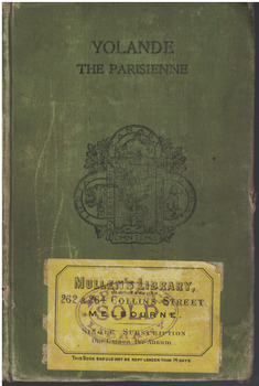 Hardcover book, 314 pages. Book has a green cover with black printed text and a family crest. Lower corner of book has a yellow label attached.