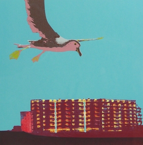 Print of a seagull flying above a building 