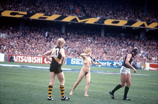 A streaker on a football field.