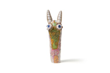 Ceramic artwork with painted patterns and mixed media assemblage.