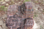 A detailed image of a brick sculpture with whirling patterns