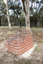 A brick sculpture set amongst gumtrees 
