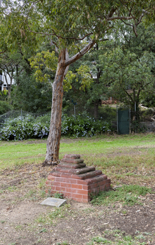 A brick sculpture set amongst gumtrees 
