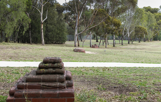 A brick sculpture set amongst gumtrees 