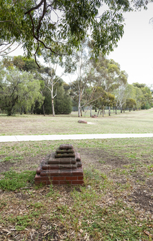A brick sculpture set amongst gumtrees 
