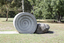 A concreate path leading to a concrete path sculpture giving the illusion the path as been rolled out. 