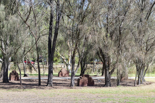 Brick sculptures installed among sheoaks.