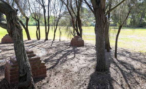 Brick sculptures installed among sheoaks.