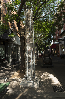 A series of large metal sculptures full of kitchenware (pots and pans etc)