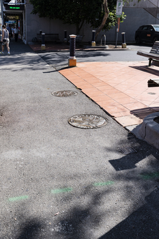 Lange bronze coins with Greek, Turkish and Italian iconography inlayed into the footpath. 