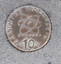 Lange bronze coins with Greek, Turkish and Italian iconography inlayed into the footpath. 