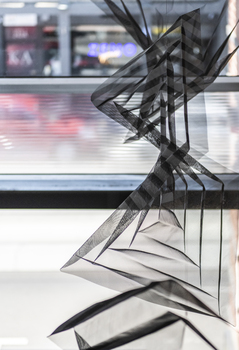 Hanging geometric forms in an entrance foyer