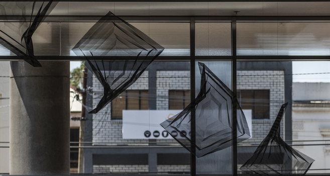 Hanging geometric forms in an entrance foyer