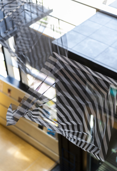 Hanging geometric forms in an entrance foyer