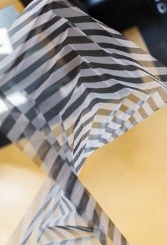 Hanging geometric forms in an entrance foyer
