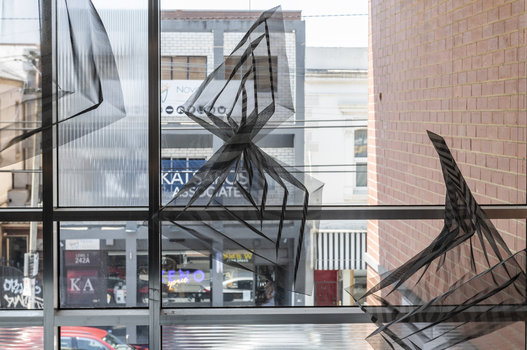 Hanging geometric forms in an entrance foyer