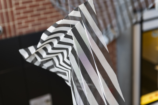 Hanging geometric forms in an entrance foyer