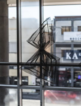 Hanging geometric forms in an entrance foyer